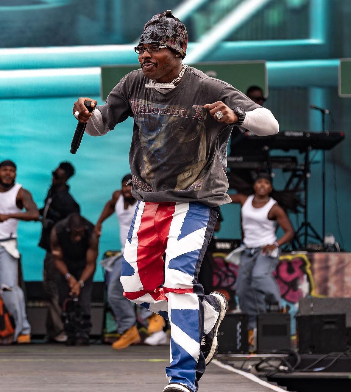 Asake performing on stage in London