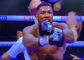 Anthony Joshua jubilates after defeating Helenius